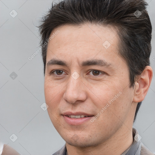 Joyful white adult male with short  brown hair and brown eyes