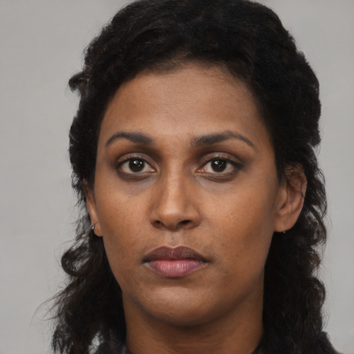 Neutral black young-adult female with long  black hair and brown eyes