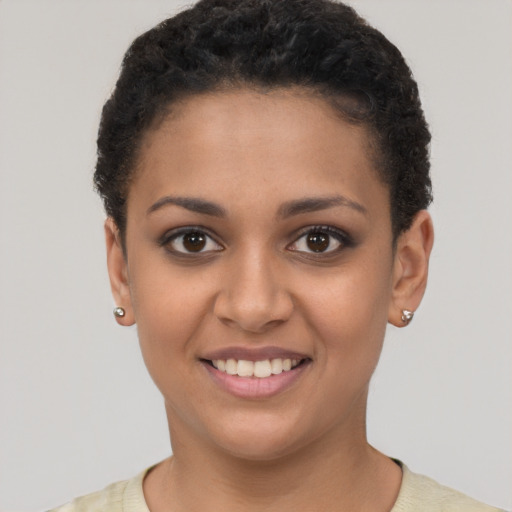 Joyful latino young-adult female with short  brown hair and brown eyes