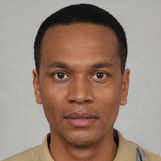 Neutral black young-adult male with short  black hair and brown eyes