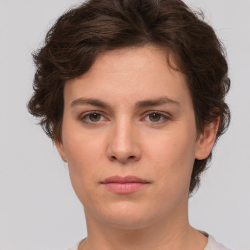 Neutral white young-adult female with short  brown hair and brown eyes