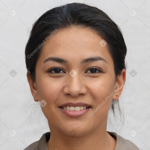 Joyful latino young-adult female with medium  brown hair and brown eyes