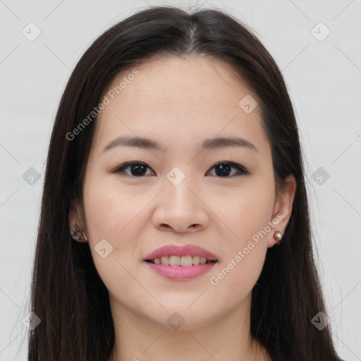 Joyful asian young-adult female with long  brown hair and brown eyes