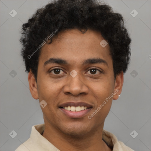 Joyful black young-adult male with short  brown hair and brown eyes