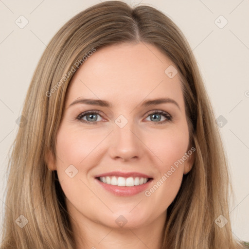 Joyful white young-adult female with long  brown hair and brown eyes