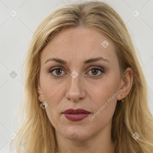 Joyful white adult female with long  brown hair and brown eyes