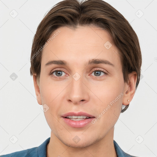 Joyful white young-adult female with short  brown hair and grey eyes