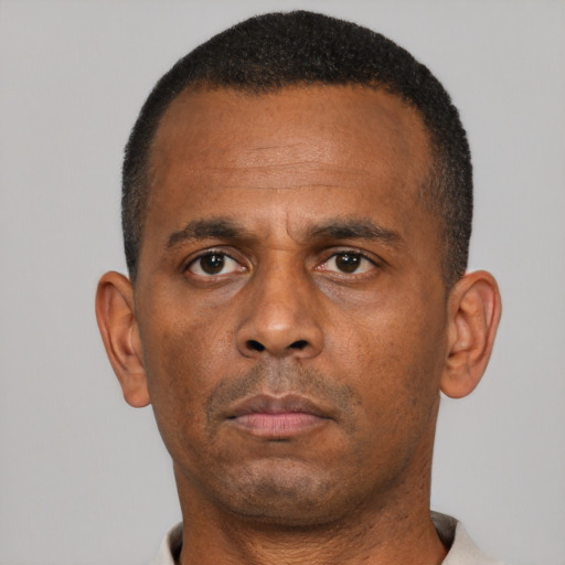 Neutral black adult male with short  black hair and brown eyes