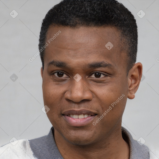 Joyful black young-adult male with short  black hair and brown eyes