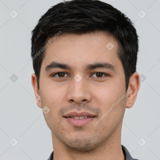 Joyful white young-adult male with short  black hair and brown eyes