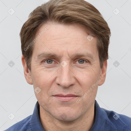 Joyful white adult male with short  brown hair and grey eyes