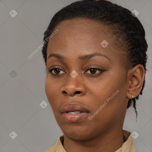 Neutral black young-adult female with medium  brown hair and brown eyes