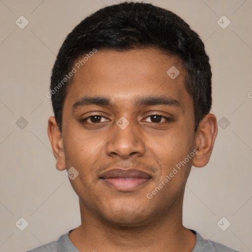 Joyful black young-adult male with short  black hair and brown eyes