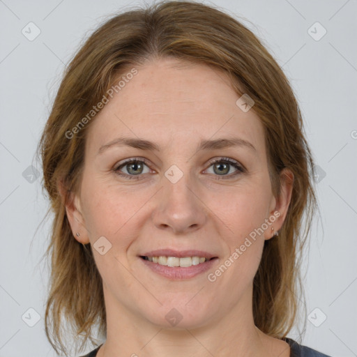 Joyful white adult female with medium  brown hair and grey eyes