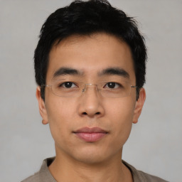 Neutral asian young-adult male with short  black hair and brown eyes