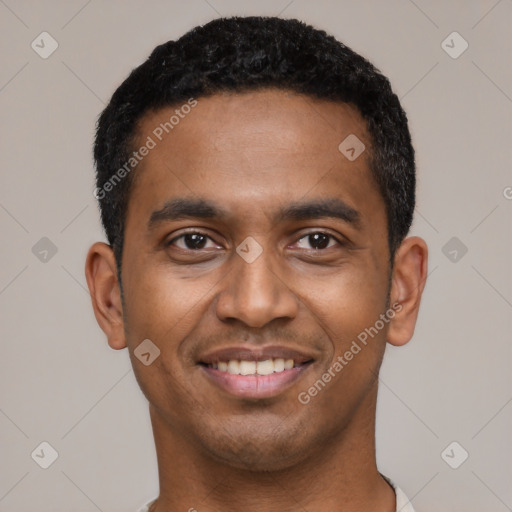 Joyful black young-adult male with short  black hair and brown eyes