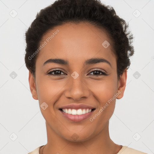 Joyful latino young-adult female with short  brown hair and brown eyes