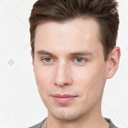 Neutral white young-adult male with short  brown hair and brown eyes