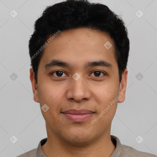 Joyful latino young-adult male with short  black hair and brown eyes