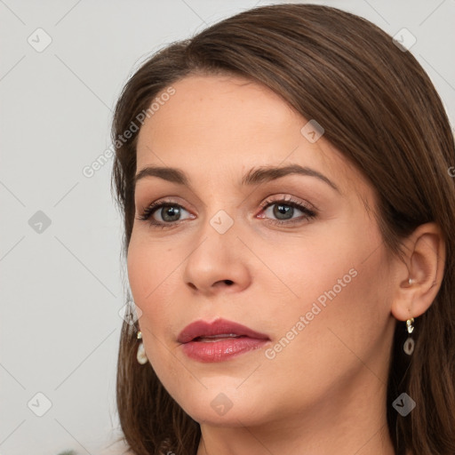 Neutral white young-adult female with long  brown hair and brown eyes