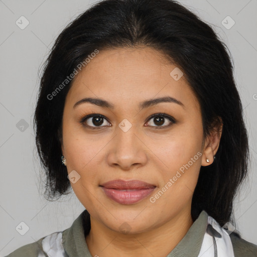 Joyful latino young-adult female with medium  brown hair and brown eyes