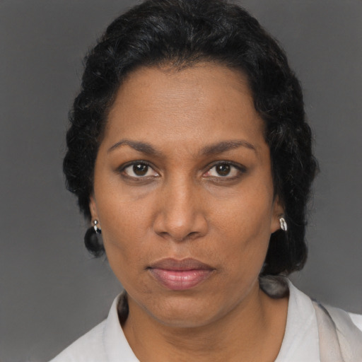 Neutral black adult female with short  brown hair and brown eyes