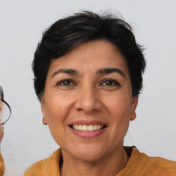 Joyful white adult female with short  brown hair and brown eyes