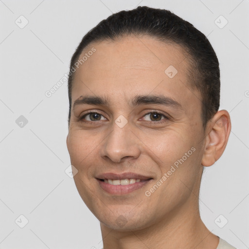 Joyful white young-adult male with short  brown hair and brown eyes