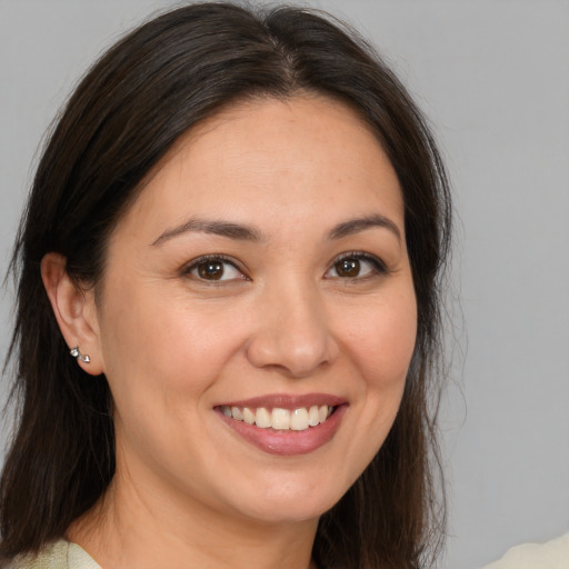 Joyful white young-adult female with medium  brown hair and brown eyes