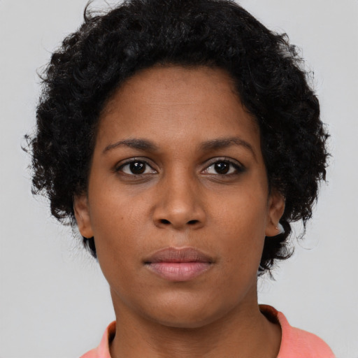 Neutral black young-adult female with short  brown hair and brown eyes