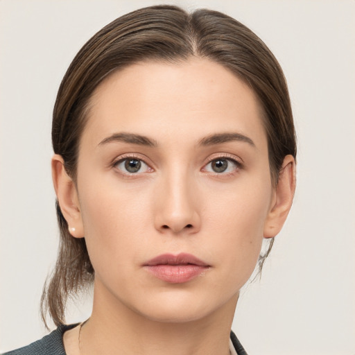 Neutral white young-adult female with medium  brown hair and brown eyes