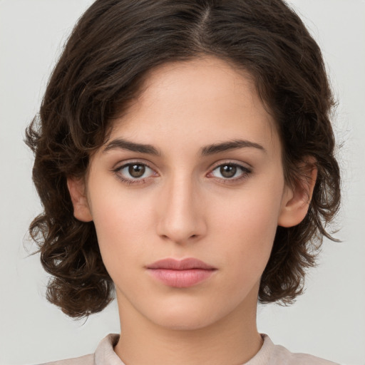 Neutral white young-adult female with medium  brown hair and brown eyes