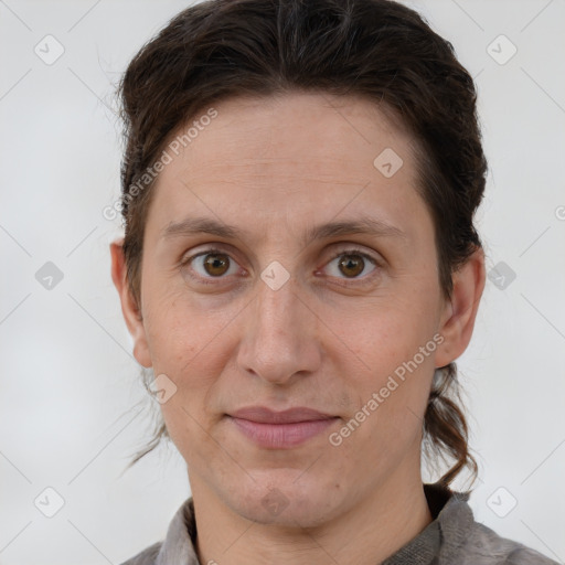 Joyful white adult male with short  brown hair and grey eyes