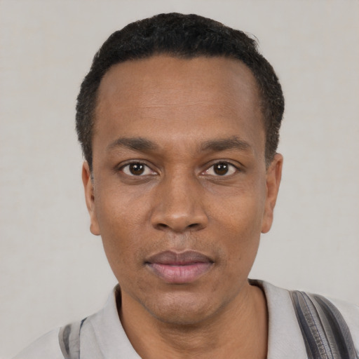 Neutral black young-adult male with short  black hair and brown eyes