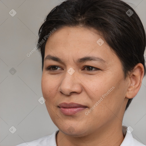 Joyful white adult female with medium  brown hair and brown eyes