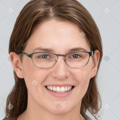 Joyful white young-adult female with medium  brown hair and grey eyes