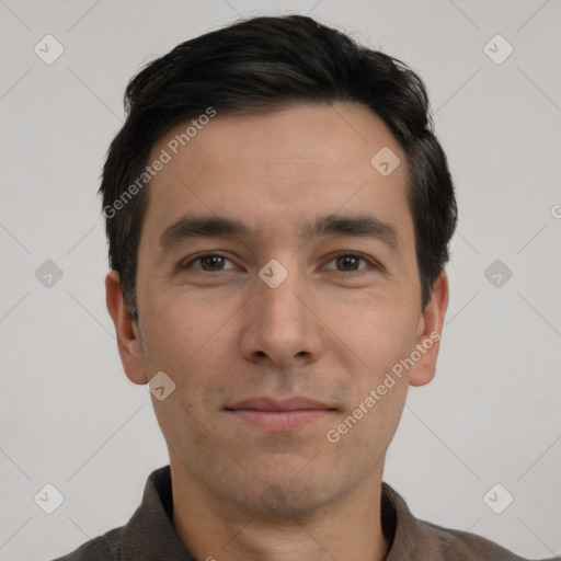 Joyful white young-adult male with short  black hair and brown eyes