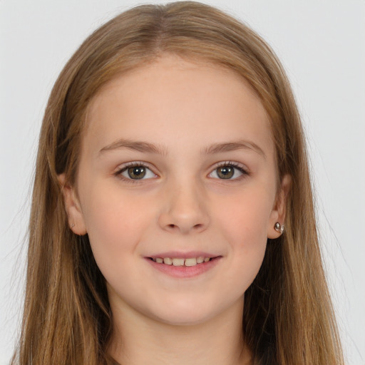 Joyful white child female with long  brown hair and brown eyes