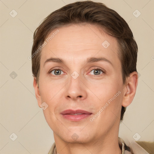 Joyful white adult female with short  brown hair and grey eyes