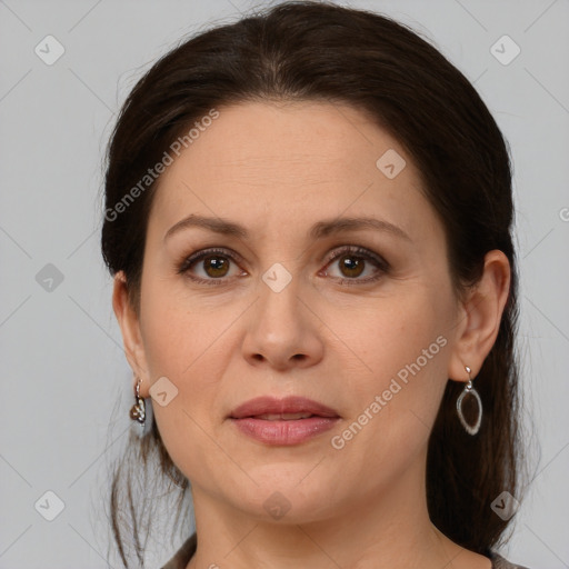 Joyful white adult female with medium  brown hair and brown eyes