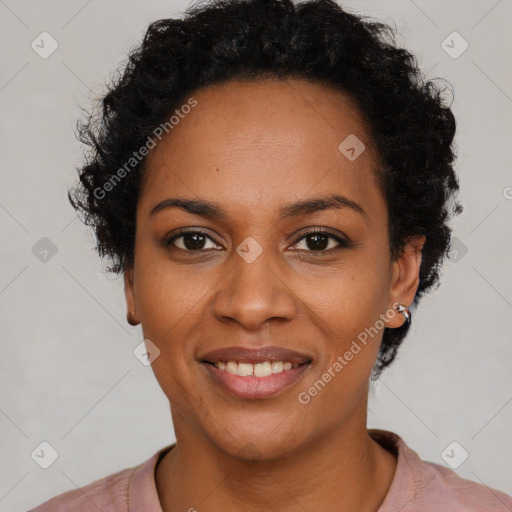 Joyful black young-adult female with short  black hair and brown eyes