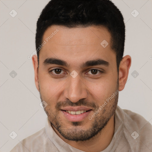 Joyful white young-adult male with short  brown hair and brown eyes