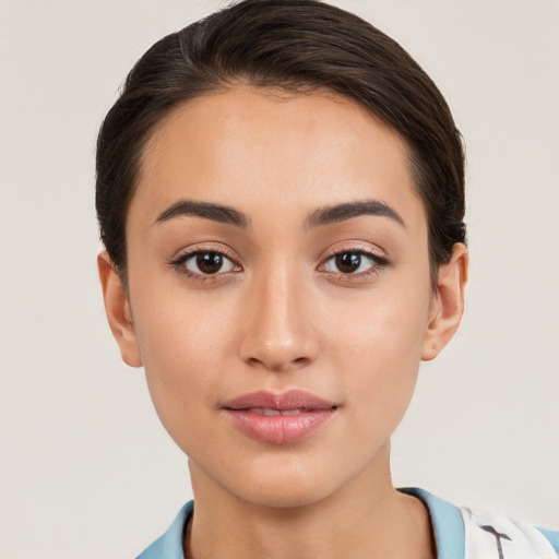 Joyful white young-adult female with short  brown hair and brown eyes