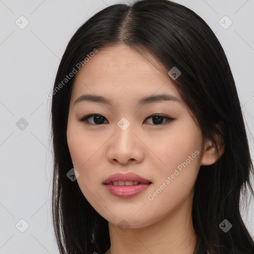 Joyful asian young-adult female with long  black hair and brown eyes