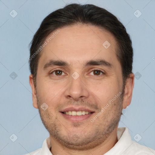 Joyful white adult male with short  brown hair and brown eyes