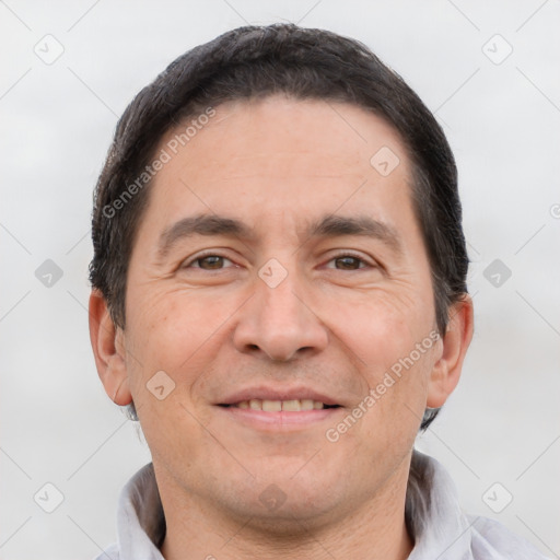 Joyful white adult male with short  brown hair and brown eyes