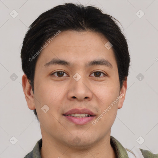 Joyful asian young-adult male with short  brown hair and brown eyes