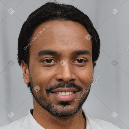 Joyful black young-adult male with short  black hair and brown eyes