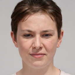 Joyful white adult female with short  brown hair and brown eyes