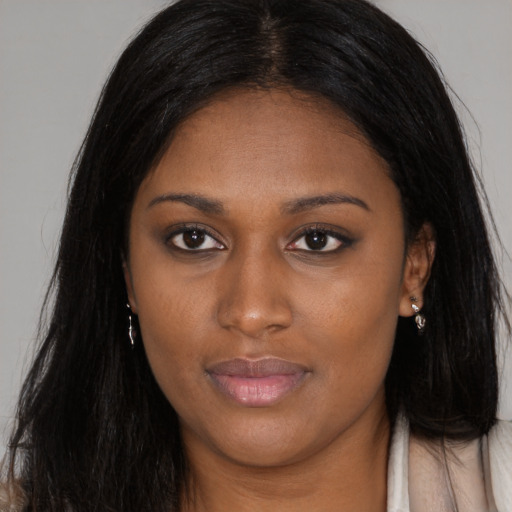 Joyful asian young-adult female with long  brown hair and brown eyes